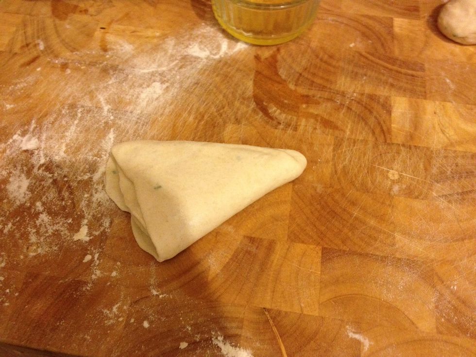 Then one last fold so it looks like a triangle. Do not spread on more Ghee this time!!