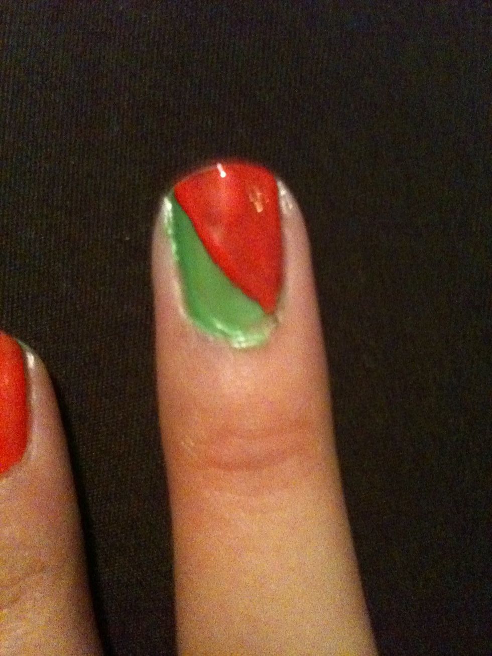 Then paint half of your middle finger nail coral/pink