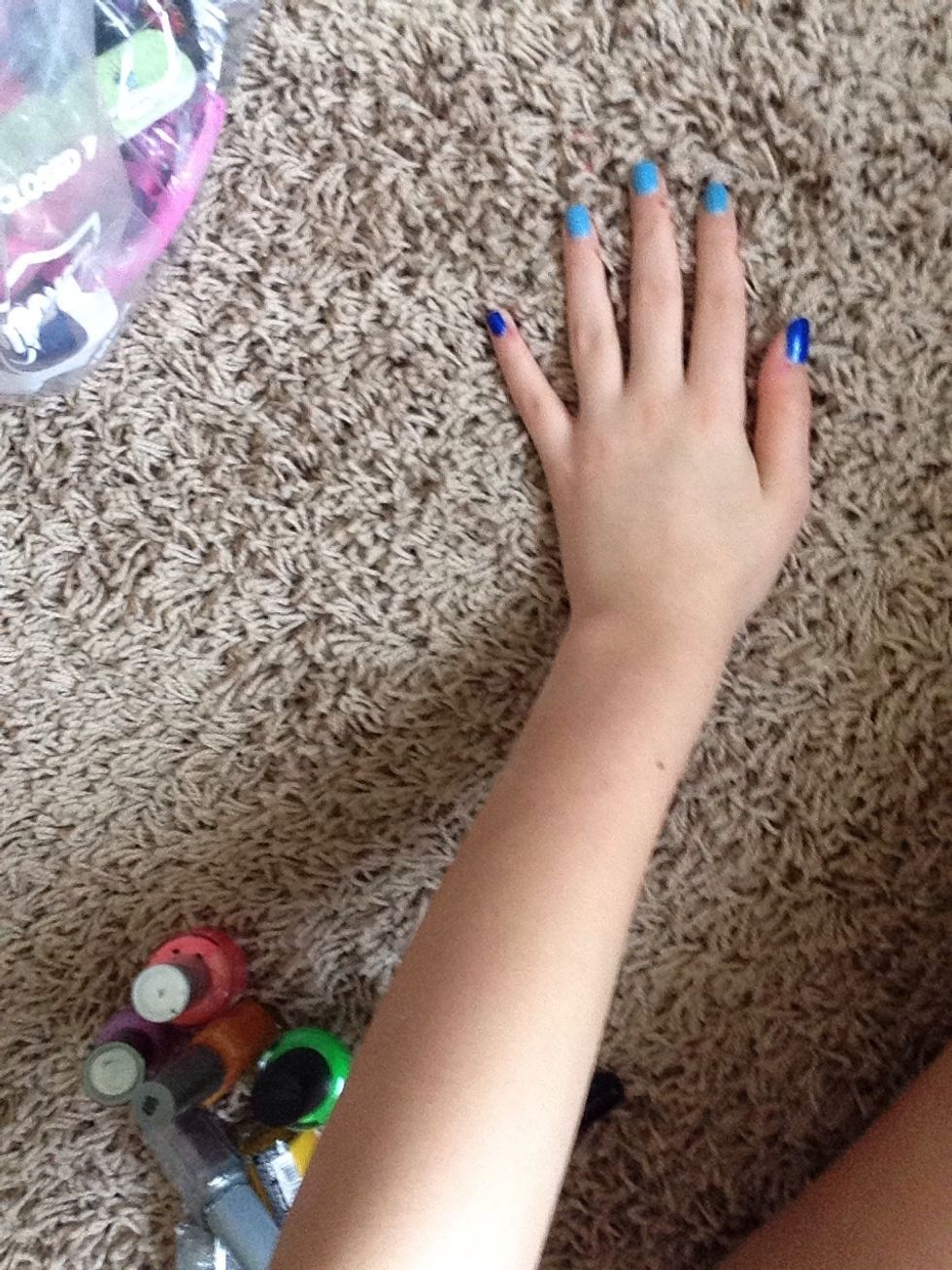 Then paint the three middle fingers light blue