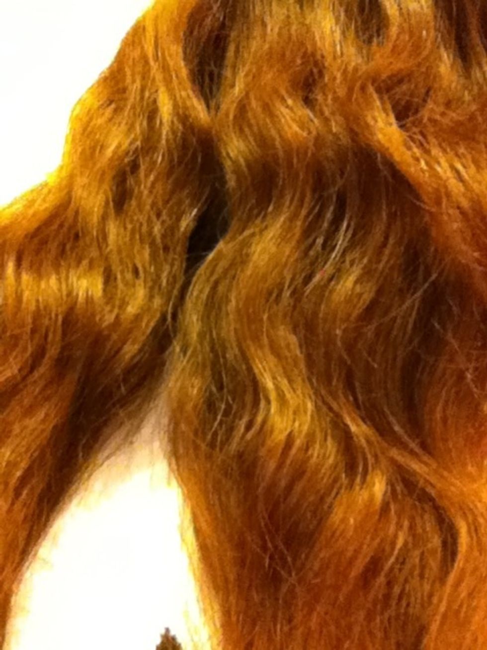 Then part your hair into two sections. Sorry, I tried to section it into two but I just wasn't feeling majestic enough to do it with one hand...\ud83d\ude0a