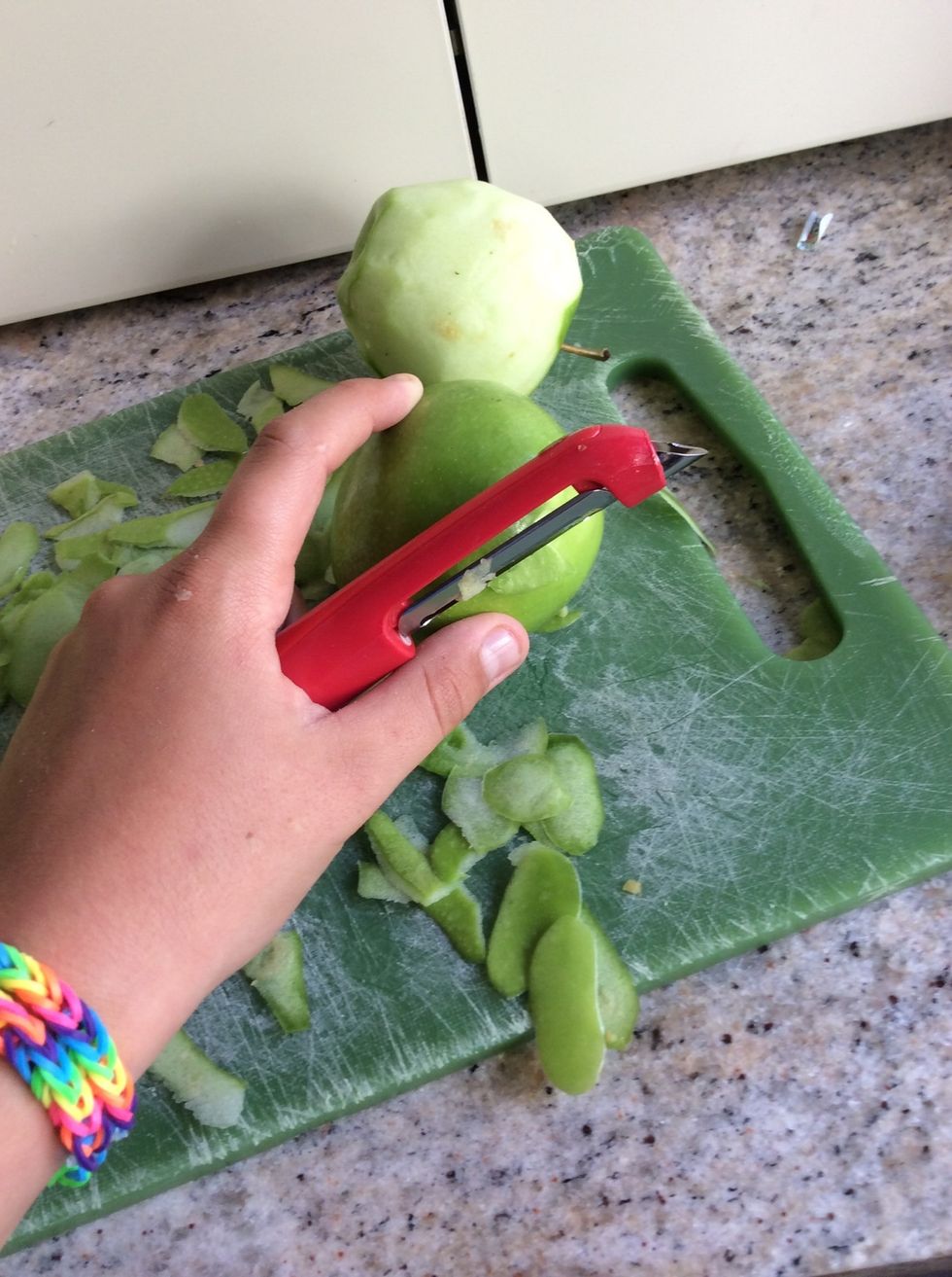 Then peel all the apples and quarter them then third the quarters.