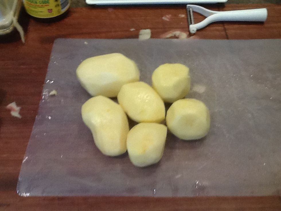 Then peel the potatoes.