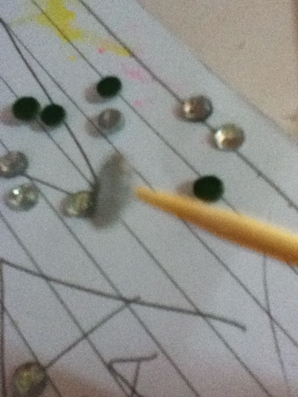 Then pick it up i don't know what is this but the pick has to be the tooth pick holding a rhinestone