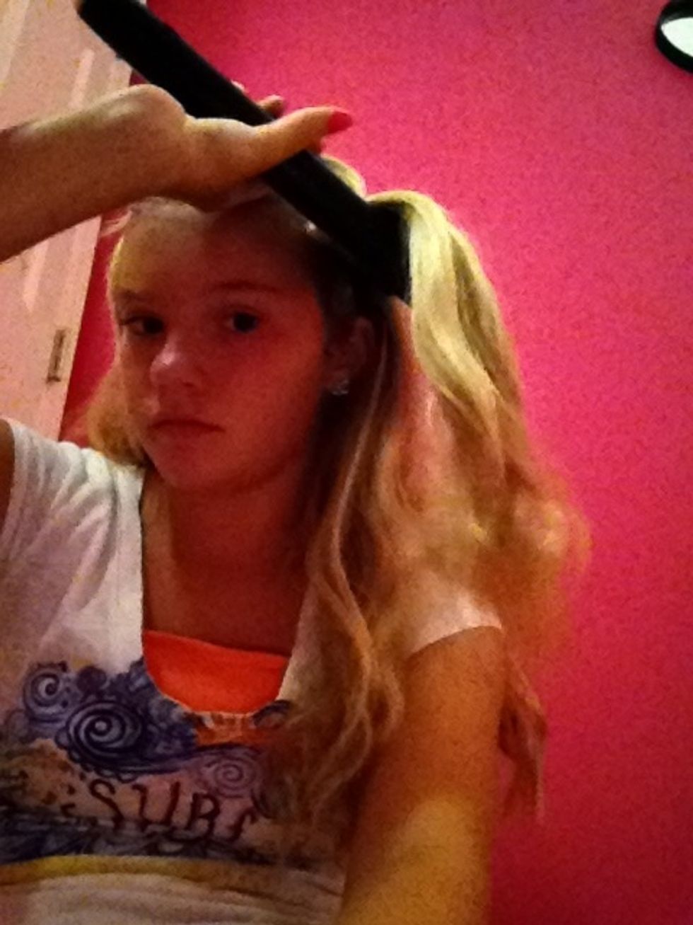 Then pick up the same strand and then where the bump was go below it and flip the curling iron up DON'T HOLD ON THERE FOR MORE THEN 10 sec !!