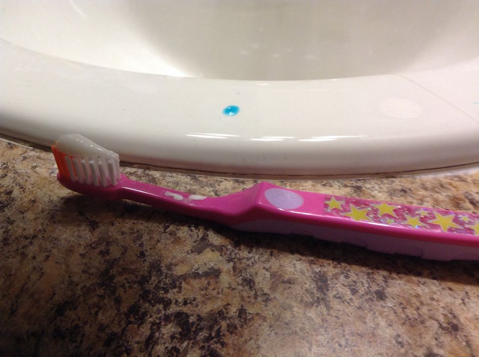 Then, pick up your tooth brush and start brushing it in curcals ow and don,t forget put a tiny bet of water