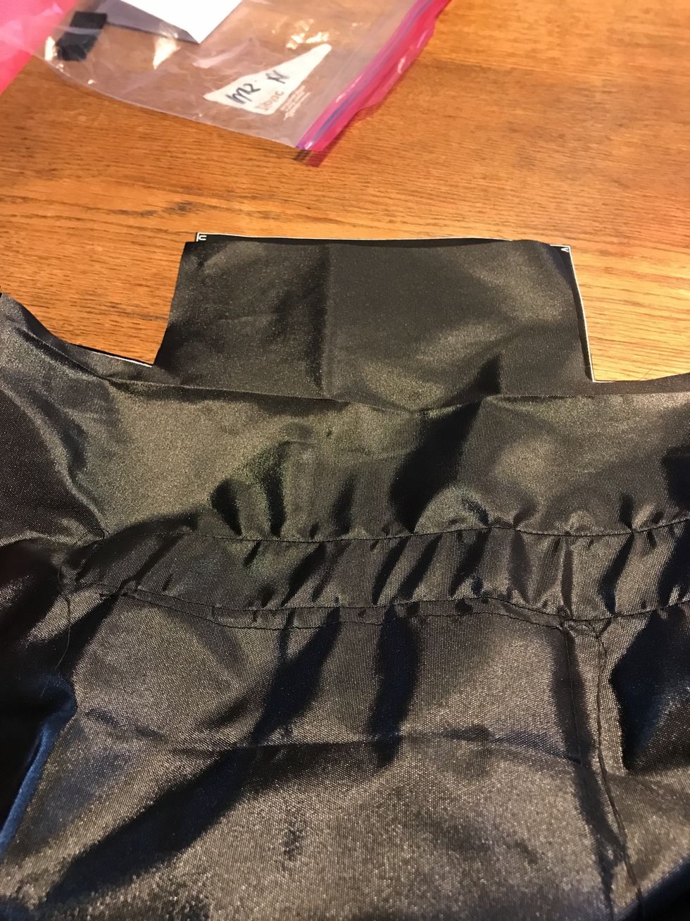 Then, pin together both sides from V to U and stitch. Don't forget to backstitch at the top and bottom of the seam. Use the right side of the pressed foot as your guide.