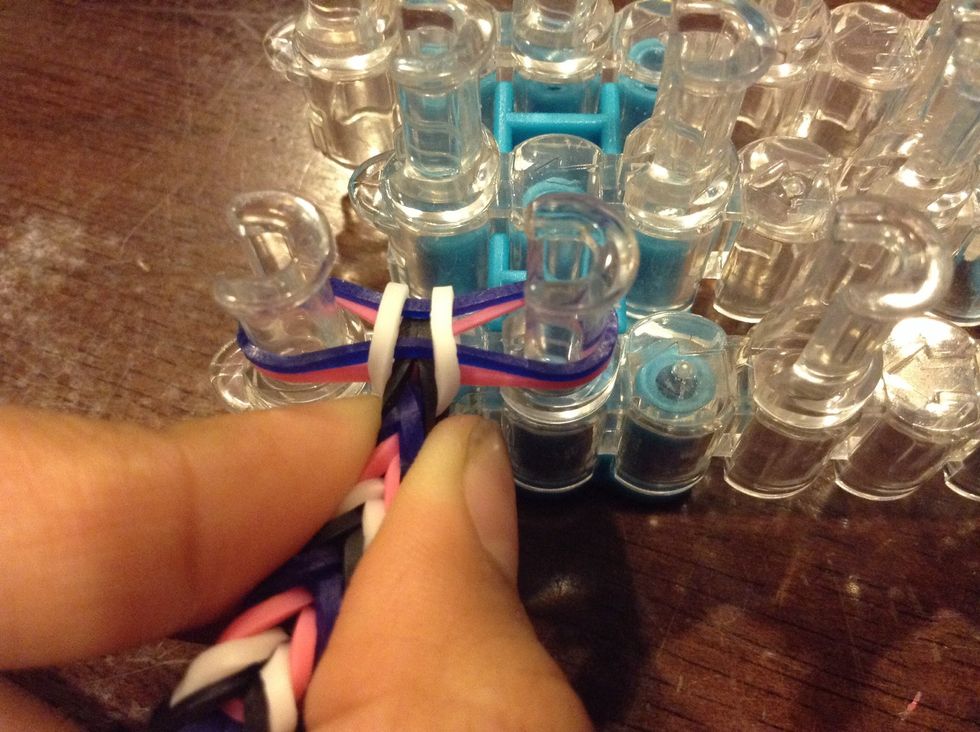 Then pinch the last 2 rubber bands and pull it off