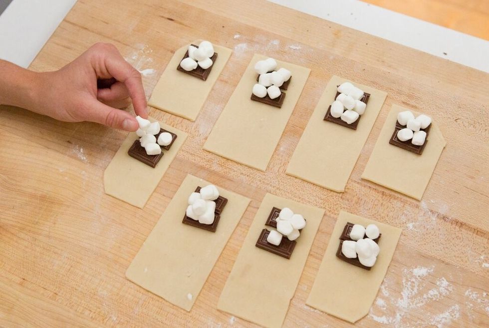 Then, place a few mini marshmallows onto each rectangle.