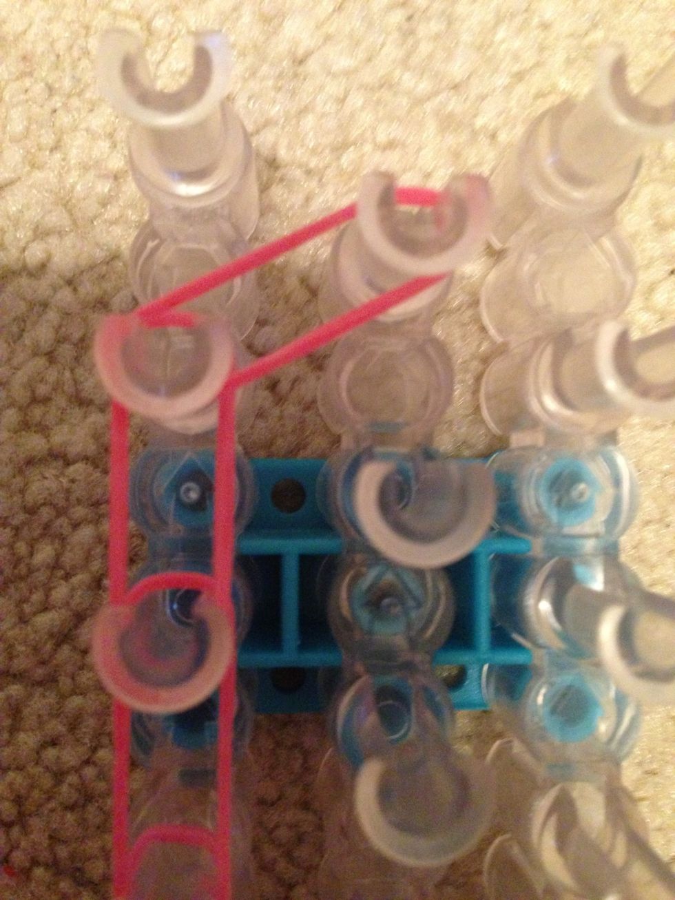 Then place a rubber band diagonal from it