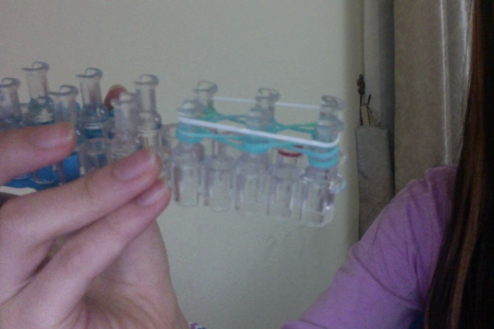 Then place another band on top (white).