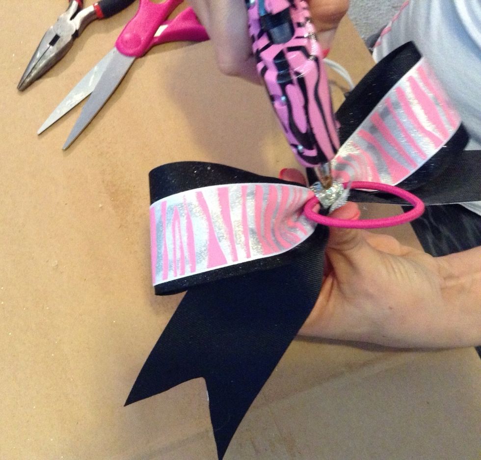 Then place another smidge of hot glue on the ribbon/fabric and secure the other end.