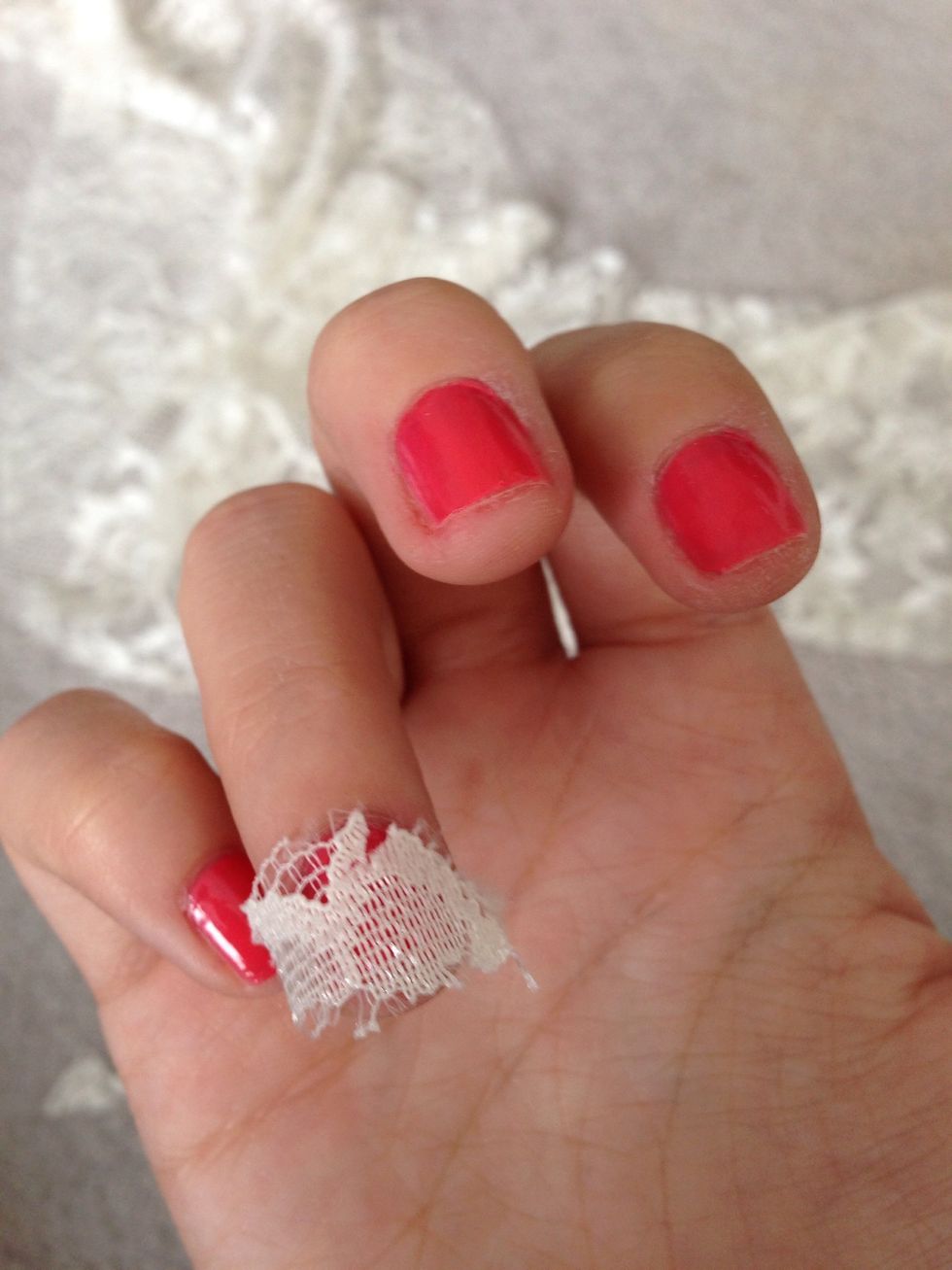 Then place it on top and cut with the cuticle trimmer to get it to your desired size