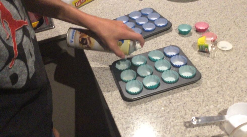Then place patties into the muffin trays and spray with cooking spray for it to stop sticking