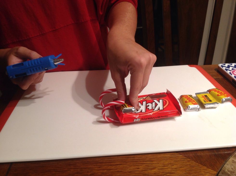 Then, place the four Mr.Goodbars on top of the KitKat bar.