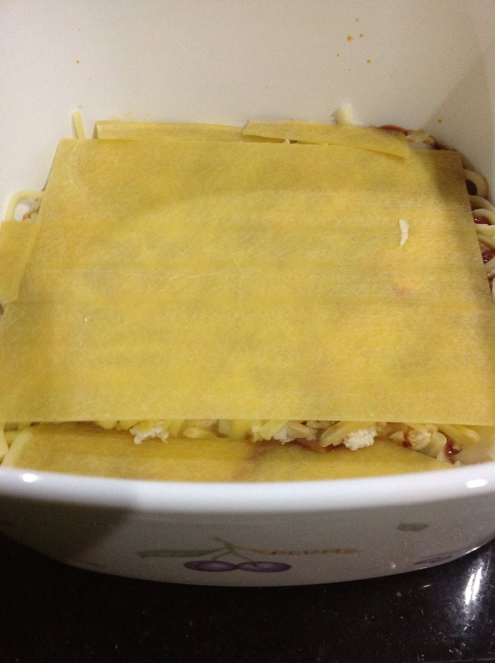 Then place the next layer of lasagna. It doesn't matter if you have to break the lasagna to cover up the corners. It'll all cook and become one anyway. :)