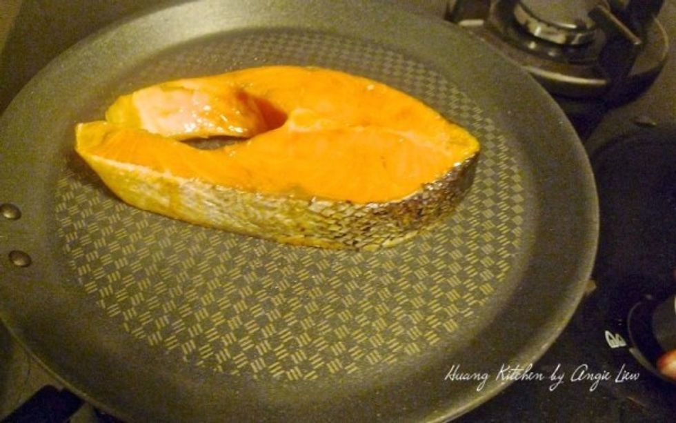 Then place the salmon fillet on the hot pan.