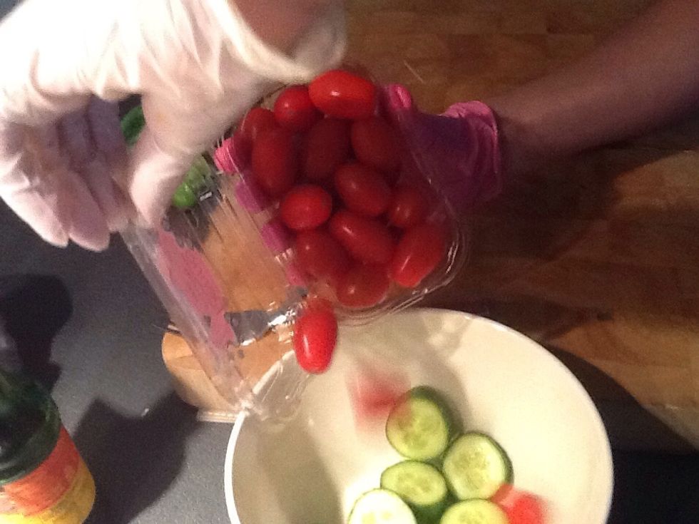 Then place the tomatoes into the bowl. You don't need to slice them if you don't want to.