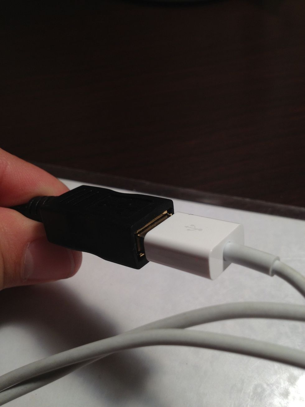 Then plug the male adapter from your iPod/iPhone cable into the Female adapter on the USB cable.