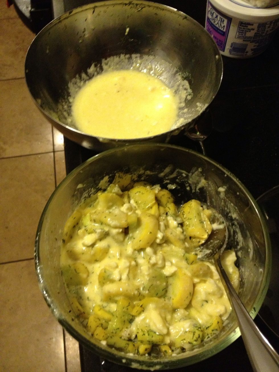 Then pour about half the feta-eggs mixture over the squash and use the back of the spoon to spread it over the surface,
