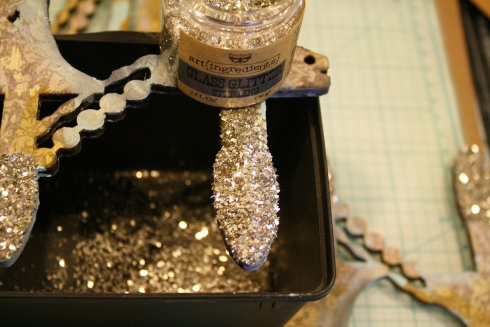 Then pour Glass Glitter on and let it dry. Tap away the excess right into your bottle. Now it's time to add your embellishments! :)