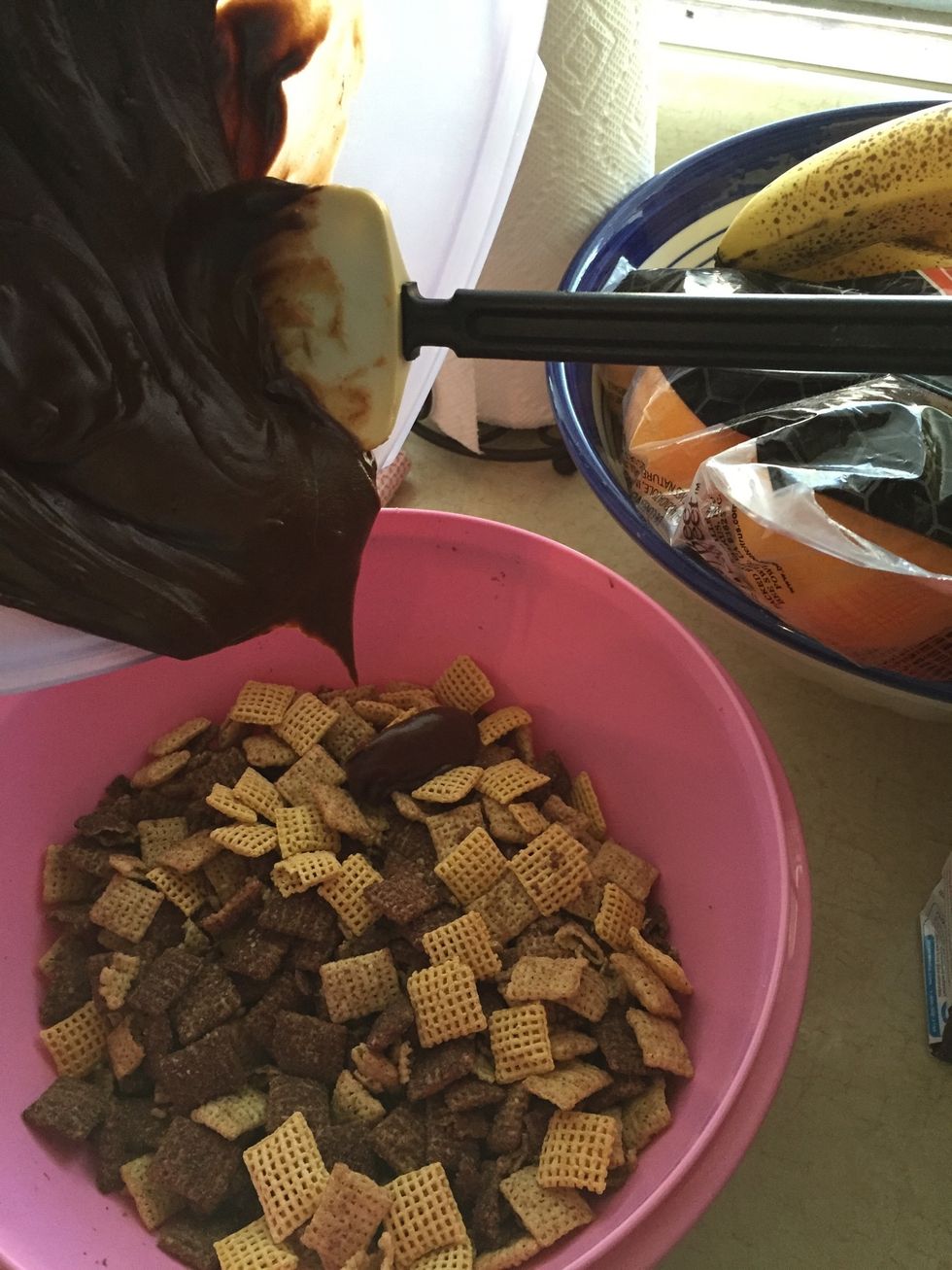 Then pour over the chex cereal and mix to distribute evenly over the chex.