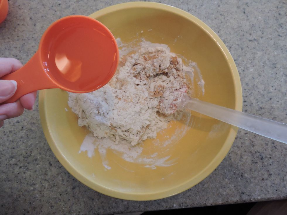 Then, pour the chicken broth in the bowl while mixing the batter.