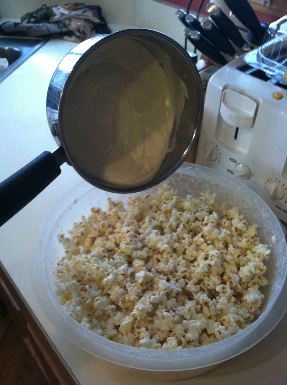 Then pour the chocolate on the popcorn
