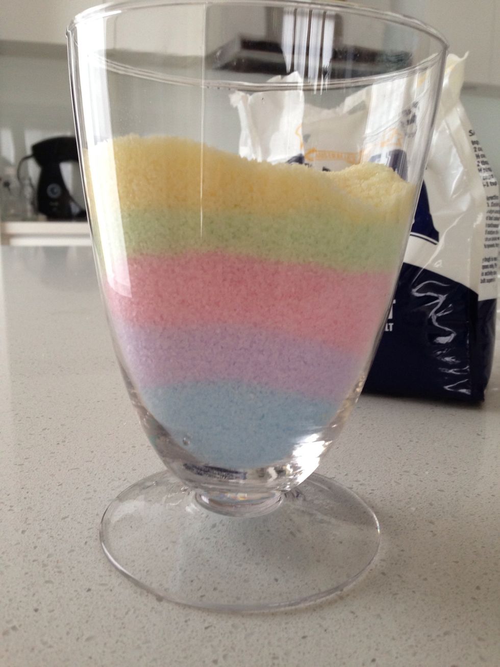 Then, pour the coloured salt into the jar, then make another colour and pour into the jar again. Keep doing it until the jar is 3/4 full.