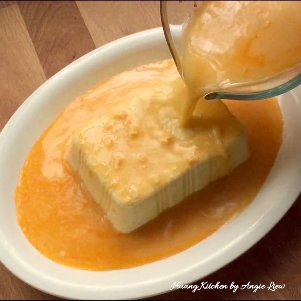 Then pour the egg mixture over the beancurd.