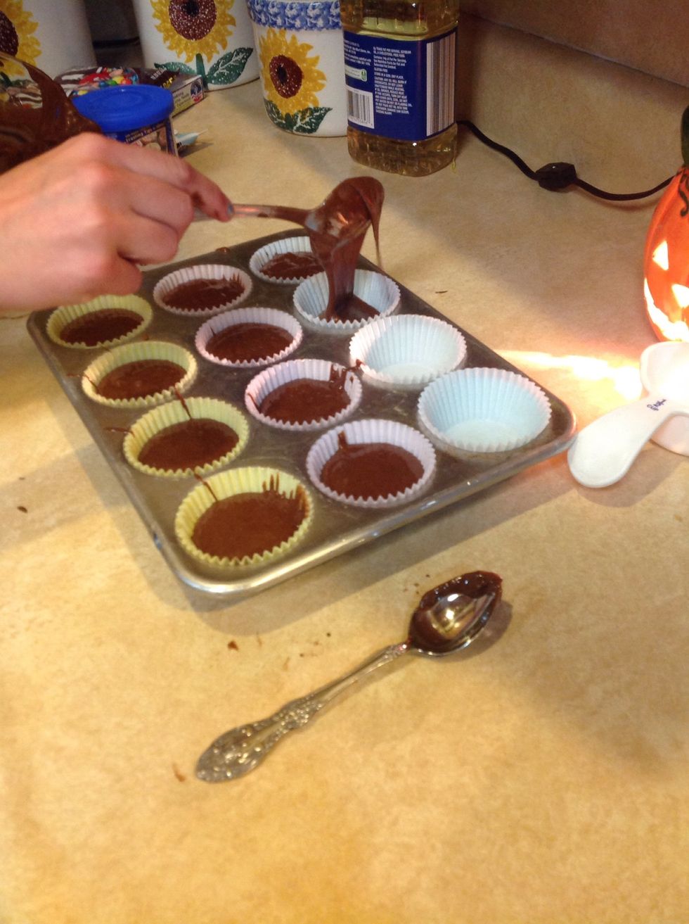 Then, pour you mixture in the cupcake holders.