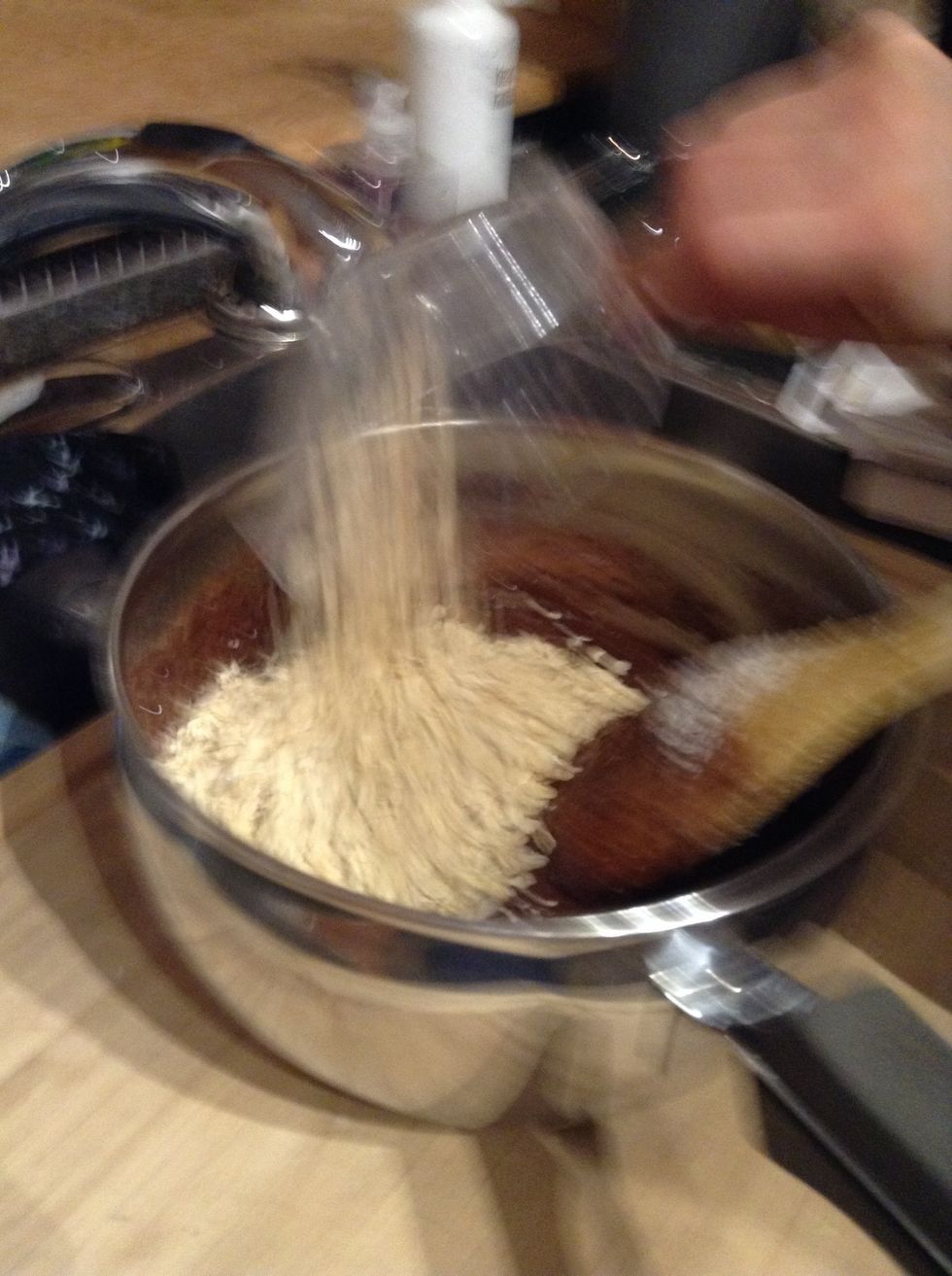 Then, pour your 3 cups of oatmeal into the pot. And get your waxed paper ready.