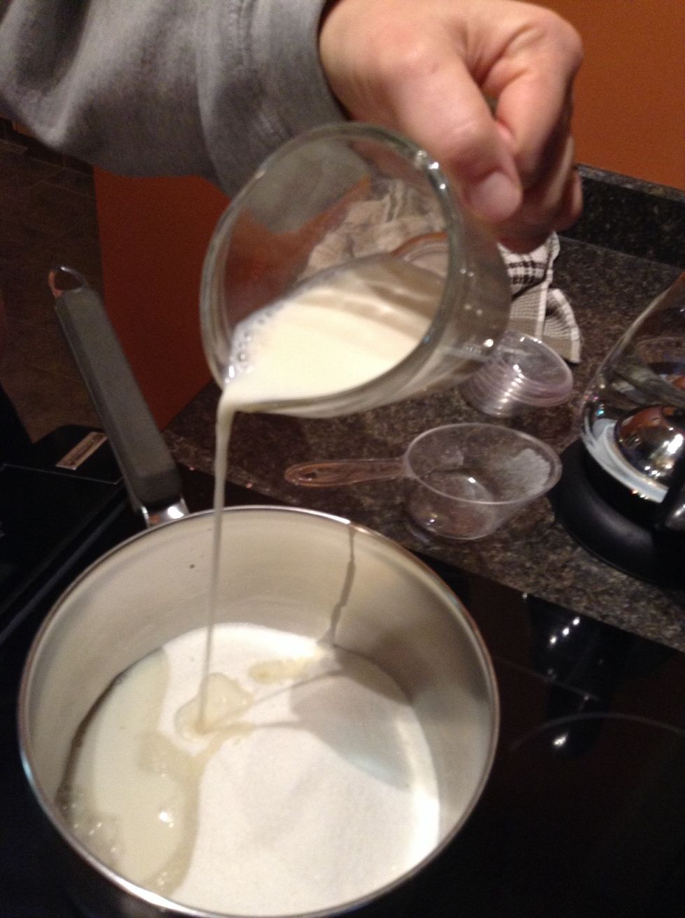 Then, pours your 1/2 cup of milk into the pot.