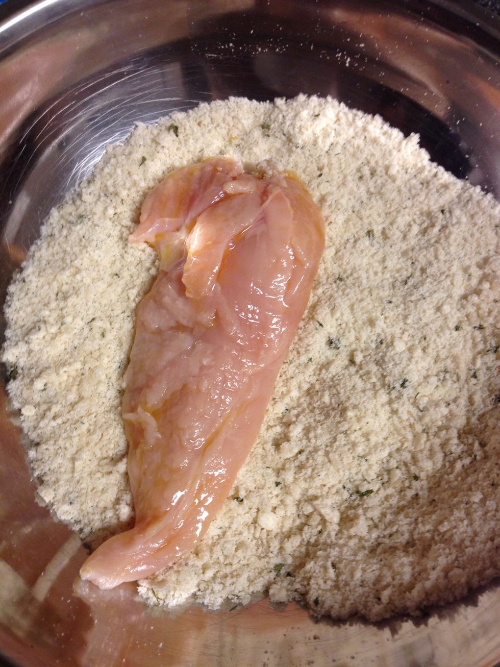 Then press each side of the chicken into the breading mix.