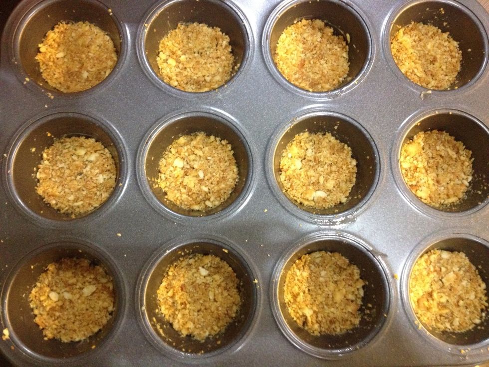 Then press it down, making it even and flat. Then pop them in the oven for 8 minutes. Once done, set aside and let to cool.