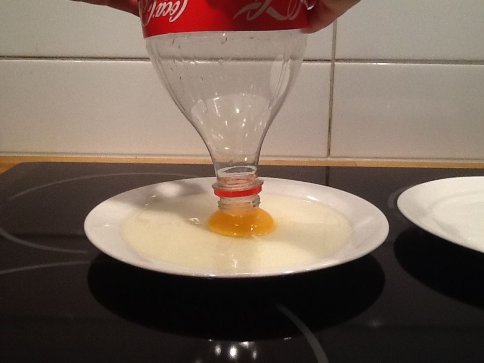 Then press the bottle to push out air and then you touch the egg with the bottle slowly and then you Release your hand carefully and slowly off the bottle so the bottle can suck up the egg.