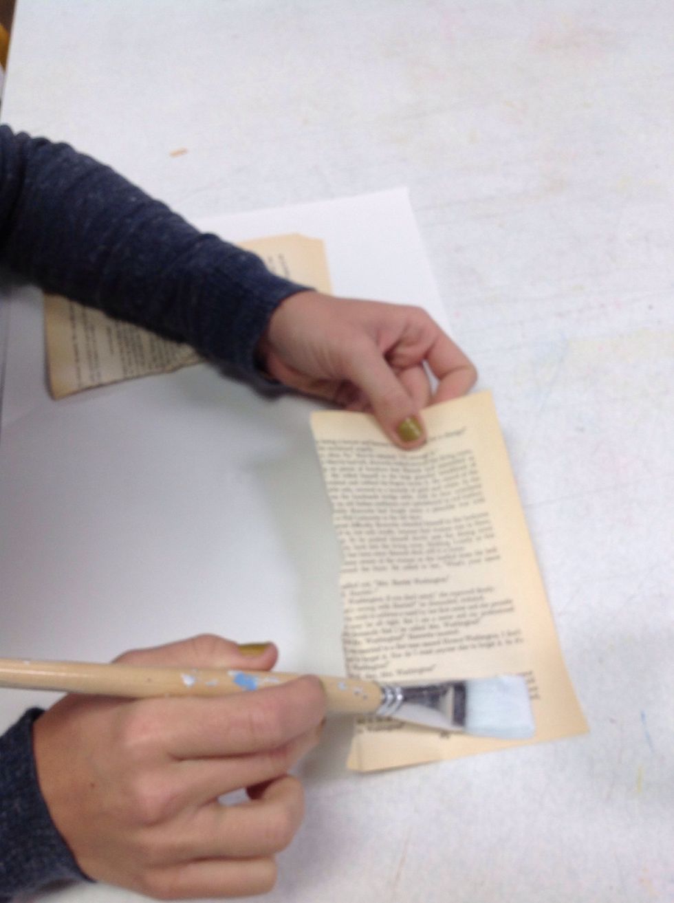 Then press the paper down on the wet varnish.Paint over with a layer of varnish and make sure all edges are secured.