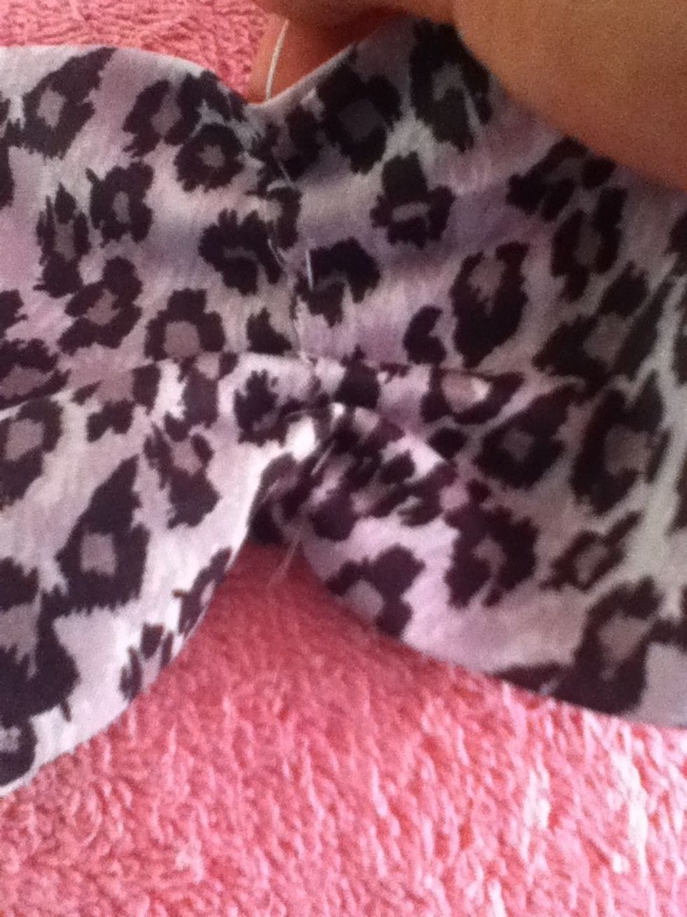 Then pull from the end of the needle down, squishing your fabric together, forming a bow.