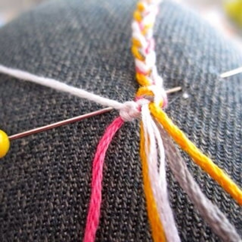 Then, pull the thread under the second from the left. Then repeat by making the "4" again. Do this step twice. So at the end of this step, you should have 2 knots. http://www.instructables.com/