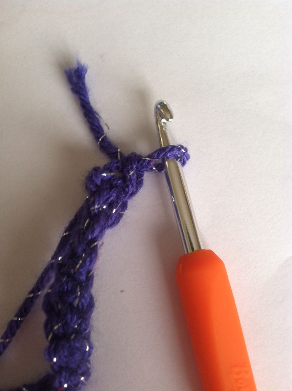 Then pull the yarn threw the hole