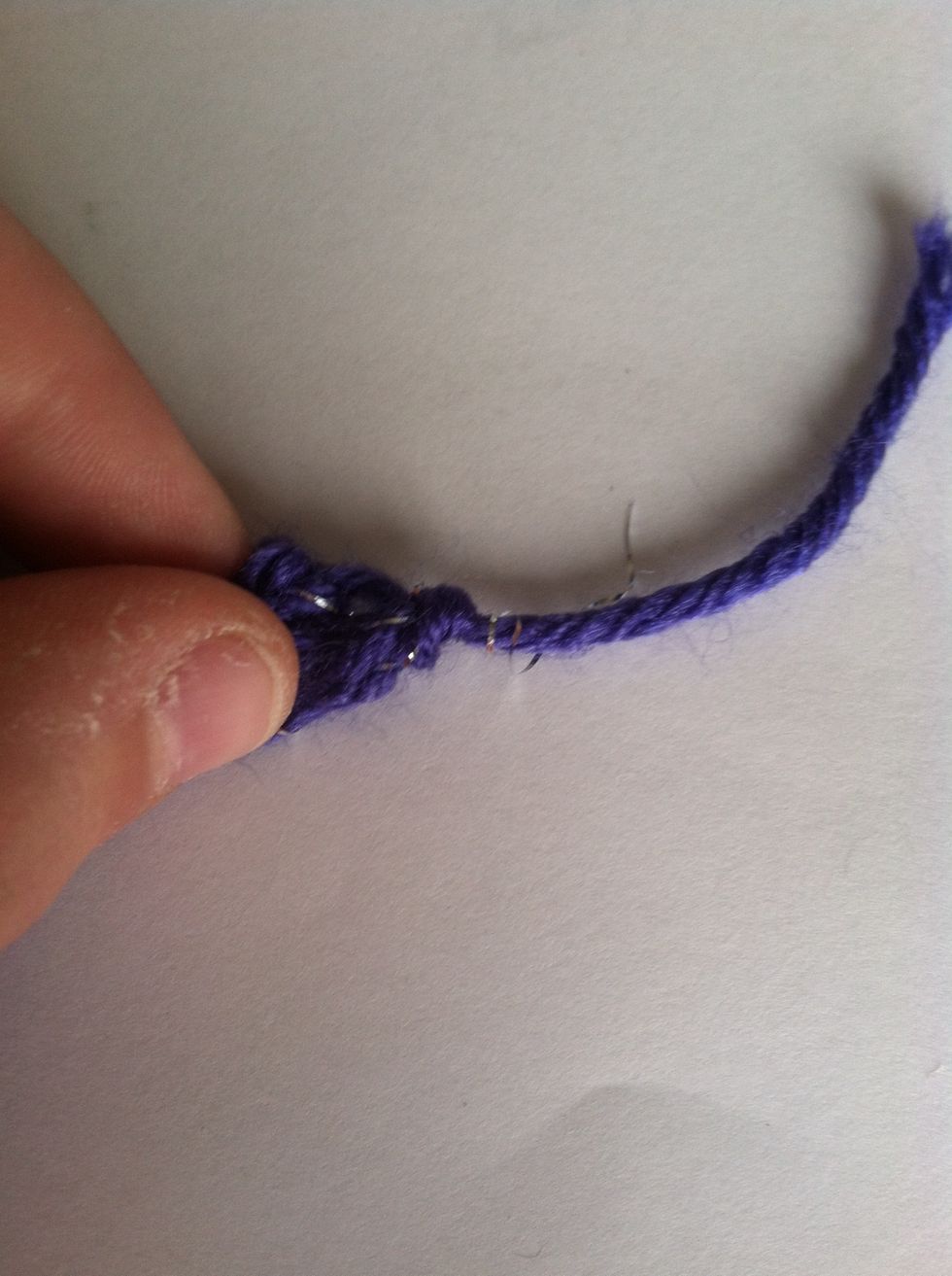 Then pull tight then cut off left over yarn