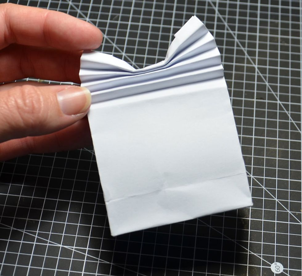 Then push down in the centre as shown. This will allow for a fan type of effect.