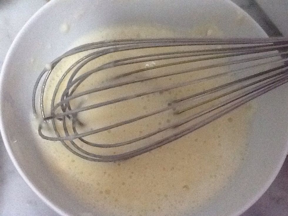 Then put a whole pack of yogurt in it with 1 tablespoon of baking powder and 4 tablespoons of white flour then bat them altogether