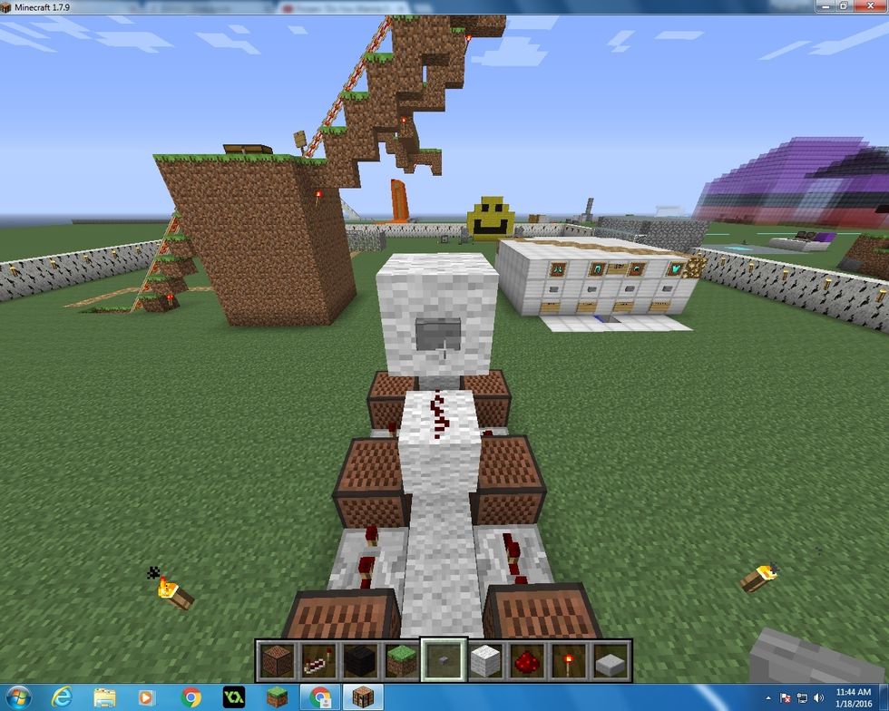 Then put another Wool block on top, so it should sit like this. And place a button on the Wool too.