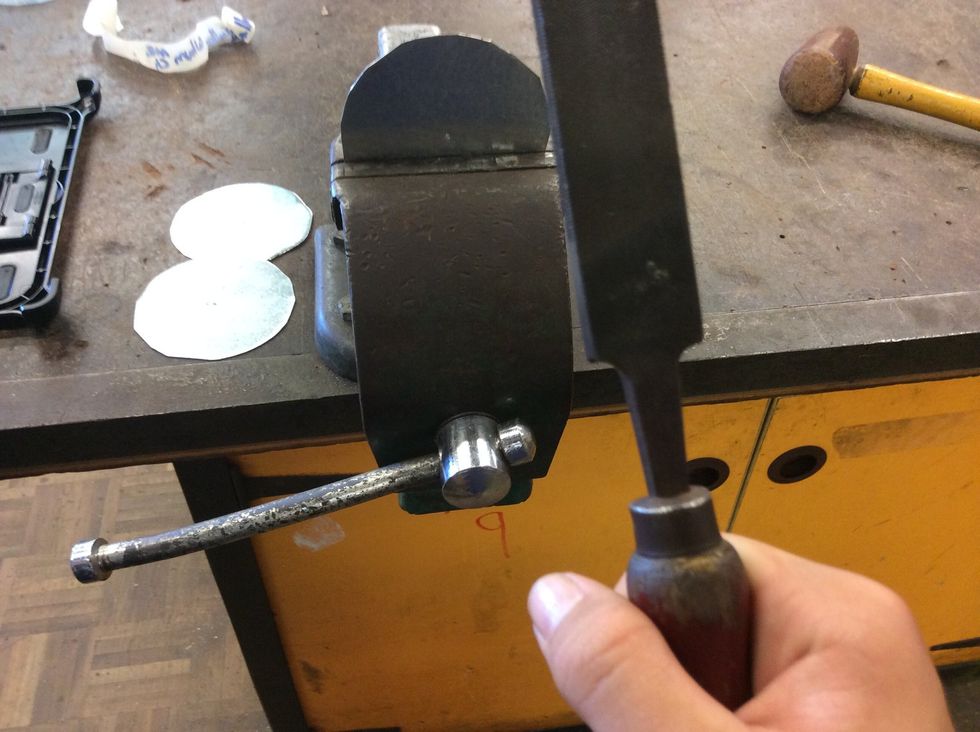 Then put it in a vice and get a file and smoothen the edges(x3).