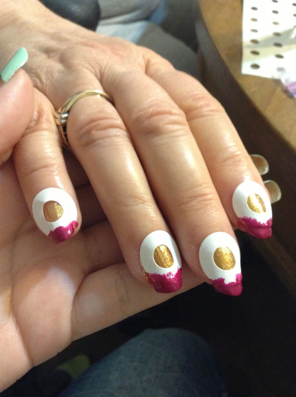 Then put on your second color. One or two coats. It's totally okay to get it on the sticker. You can take off the sticker immediately, or I wait about ten minutes. And carefully peel them off.