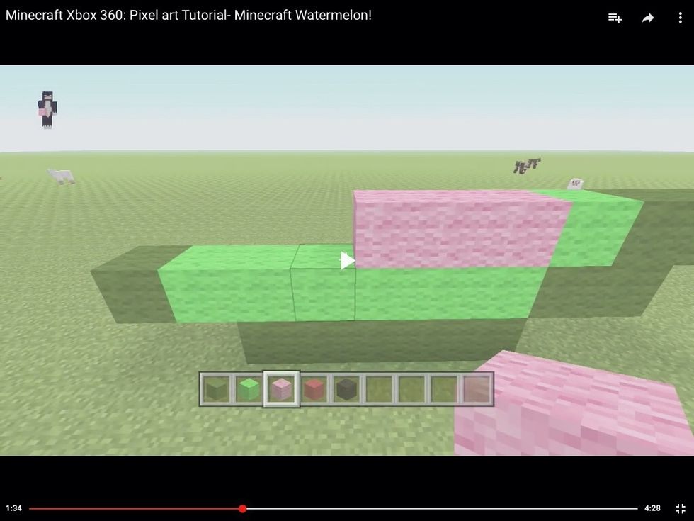 Then put one light green wool and then continue with the pink wool