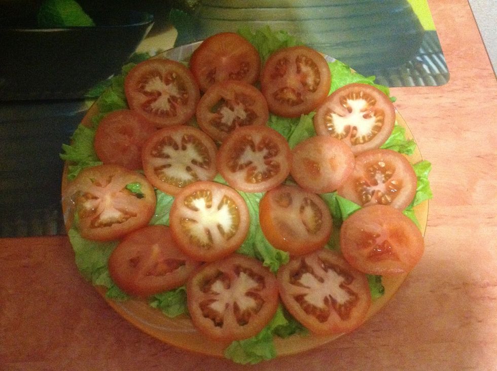 Then put pieces of tomatoes, ad some salt and pepper