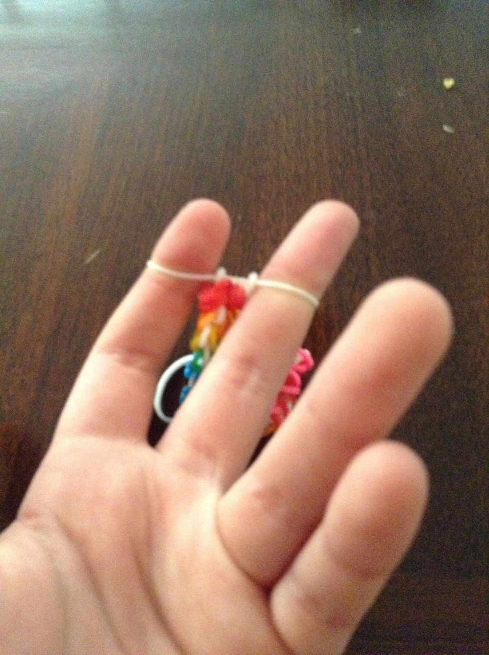 Then put the bottom right band in the middle