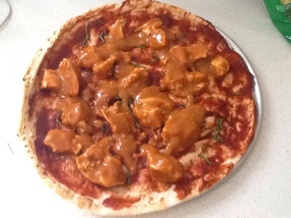 Then put the butter chicken on the pizza