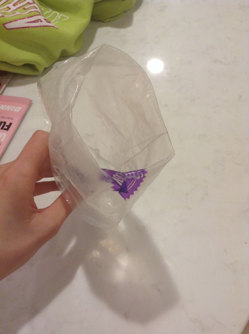 Then, put the frosting in the bag.